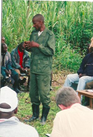An RPR-Inkeragutabara commander with journalists, refugees, local leaders,  MONUSCO